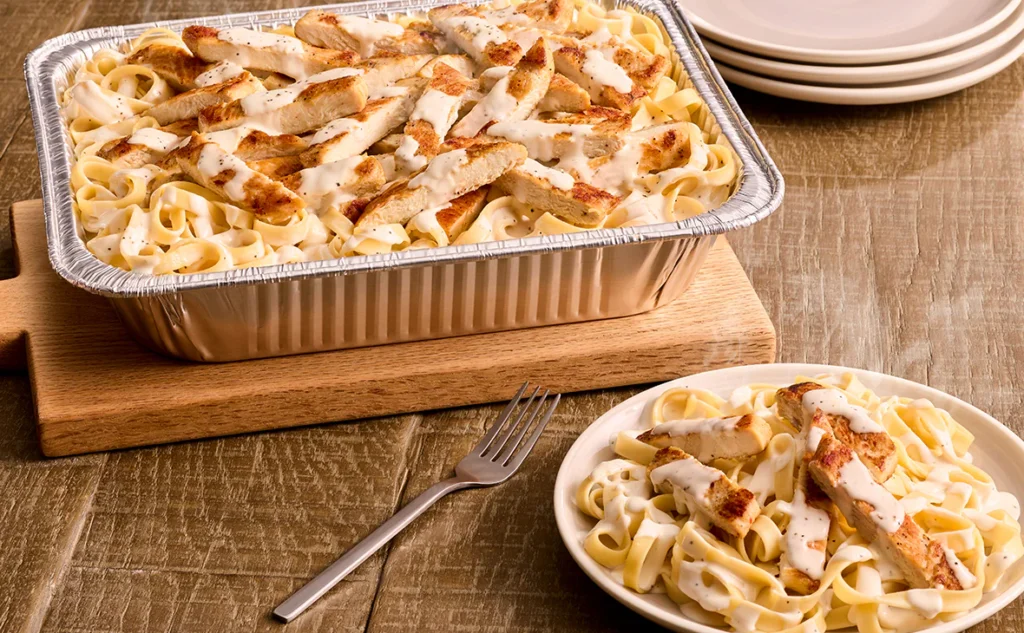 Family size Chicken Alfredo from Olive Garden serves 4-6 with grilled chicken and creamy garlic parmesan sauce