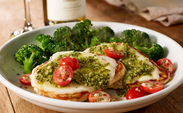 Grilled chicken margherita topped with fresh tomatoes, mozzarella cheese, basil, and lemon garlic sauce