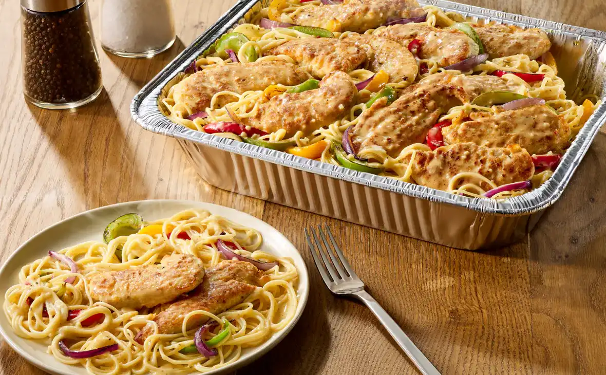 Chicken Scampi pasta serves 4 to 6 people with garlic sauce, peppers, and onions