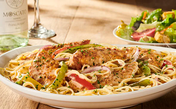 Chicken scampi pasta with sautéed chicken, bell peppers, and creamy garlic butter sauce