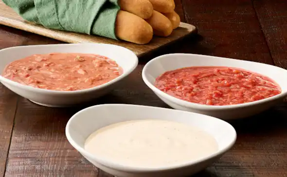 Freshly baked vegetarian breadsticks served with marinara and alfredo dipping sauces