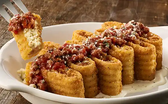 Crispy fried Lasagna Fritta filled with cheese and served with marinara sauce