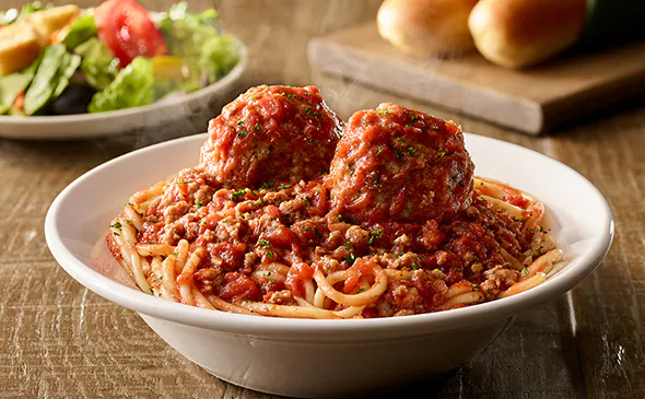 Classic Spaghetti and Meatballs pasta served with marinara sauce and parmesan cheese