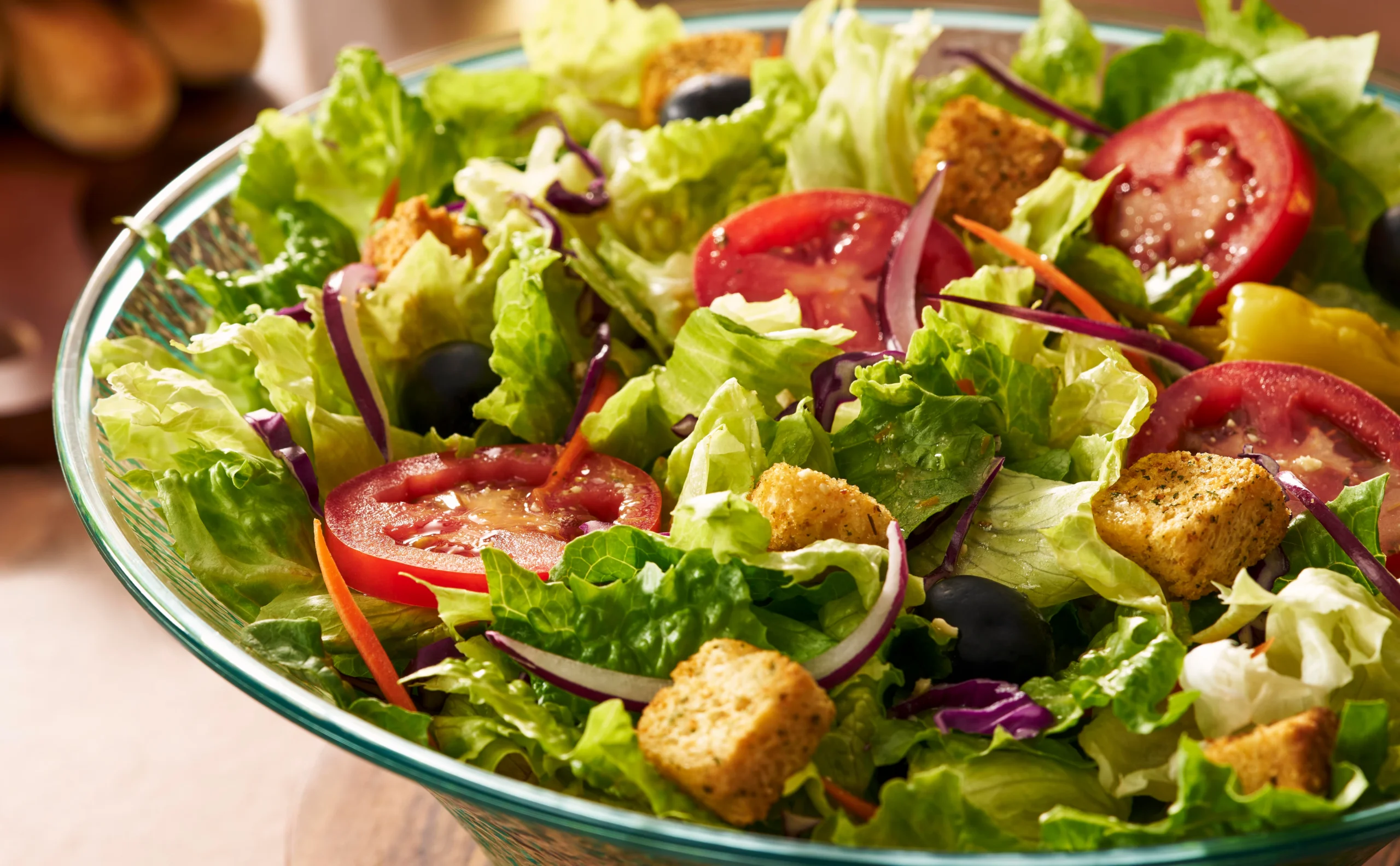 Our famous house salad with fresh lettuce, tomatoes, olives, and dressing
