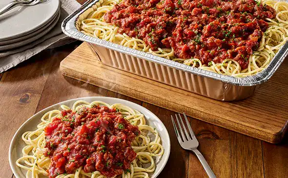 Spaghetti with meat sauce serves 4 to 6 people topped with parmesan cheese