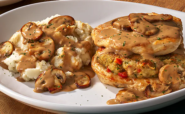 Stuffed chicken marsala filled with cheese and herbs, served with mushroom wine sauce