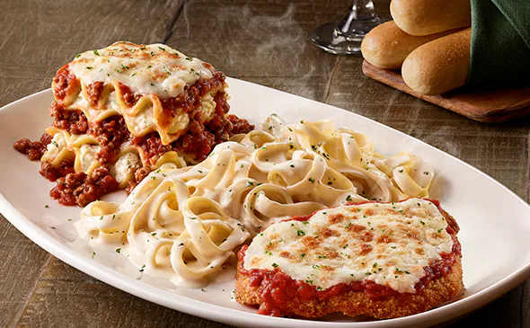 Tour of Italy platter with Chicken Parmigiana, Lasagna Classico, and Fettuccine Alfredo