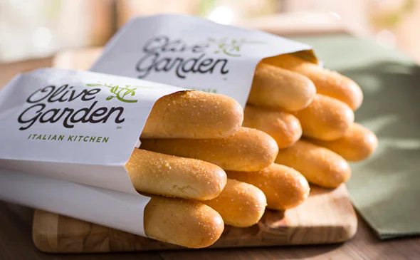 Freshly baked breadsticks served warm with garlic butter