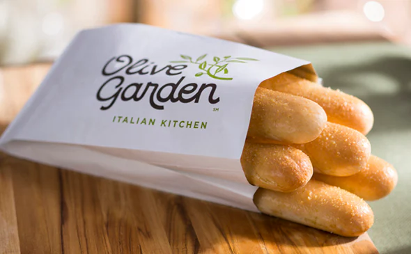Freshly baked vegetarian breadsticks served warm with garlic butter