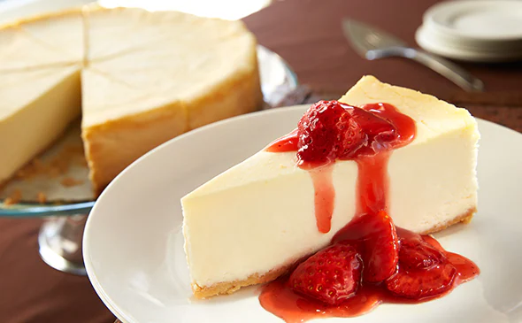 Creamy Sicilian cheesecake topped with strawberry sauce and fresh berries