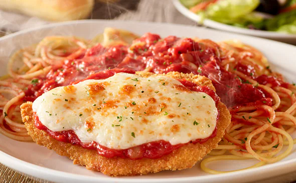Crispy Chicken Parmigiana topped with marinara sauce and melted mozzarella cheese