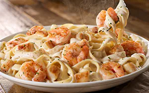 Creamy Seafood Alfredo pasta recipe with shrimp and scallops served with fettuccine