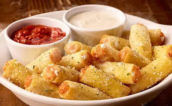 Crispy stuffed ziti fritta pasta bites filled with cheese and served with marinara sauce